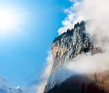 Sun, clouds and fog in the Bernese Alps.