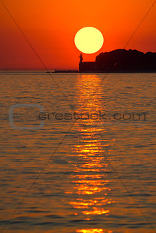 Sunset over lighthouse in Zadar