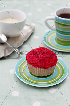 Red cupcake with coffee and cream