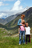 Family  on summer Alps mountain 