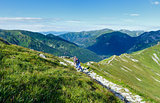 Summer Tatra Mountain (Poland) and family on path