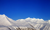 Snowy mountains and blue clear sky
