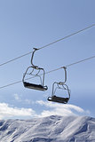Chair lifts and off piste slope at nice day