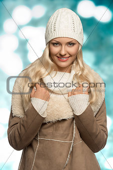 smiling winter girl with wool cap