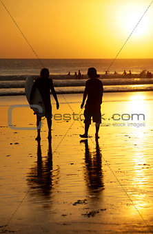 Surfers on a coastline
