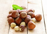 heap hazelnuts (filberts) on wooden background