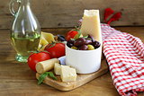 olives, parmesan cheese, tomatoes and basil