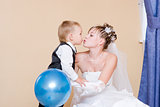 A bride kisses her little brother