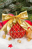 red christmas ball with golden bow
