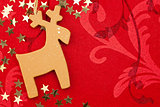 Red Christmas Background with Handmade Reindeer, Golden Stars an