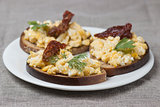 a classic, simple breakfast: scrambled eggs on toast