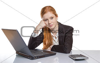Young businesswoman sitting in front of her notebook