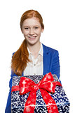Young red haired Girl presenting a gift
