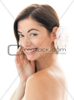 attractive woman in her forties with a flower in her hair