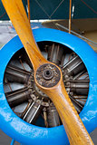 Old aircraft engine with wood propeller, vintage plane close up