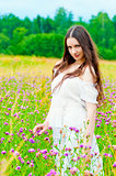 beautiful girl standing in a field