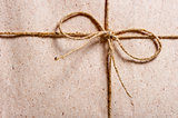 parcel wrapped in brown paper and tied with twine