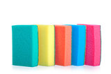 colorful sponges for washing dishes stand in a row