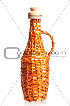straw wicker bottle for oil with cork