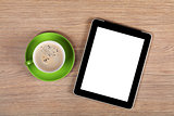 Tablet with blank screen and coffee cup