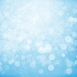 Blurred bokeh nature background with snow flakes