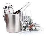 Champagne bottle in bucket, glasses and alarm clock