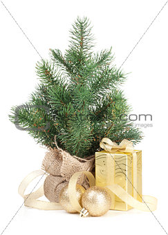 Small christmas tree with decor and gift box