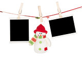 Two blank photos and snowman hanging on the clothesline