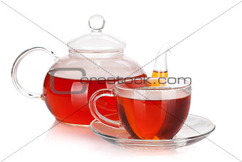 Glass cup and teapot of black tea