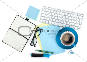 Blue coffee cup and office supplies