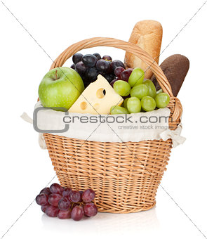 Picnic basket with bread and fruits