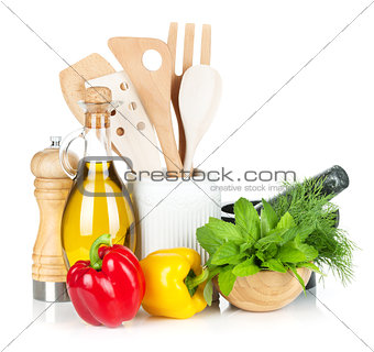 Fresh ripe vegetables, herbs and kitchen utensils