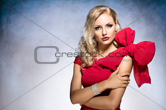 blond young girl in red with big bow