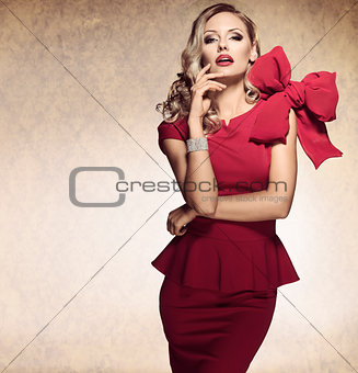 arrogant blond sexy girl. red dress