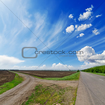 two rural road  under cloudy sky