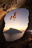 Female rock climber at sunset, Kalymnos Island, Greece