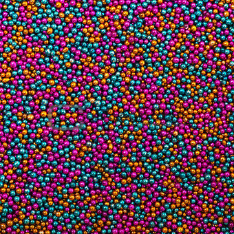 Background from Turquoise, Pink and Golden Balls of Bead