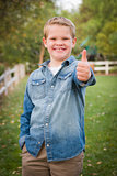 Handsome Young Boy Giving the Thumbs Up