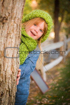 Portrait of Cute Young Girl Wearing Green Scarf and Hat