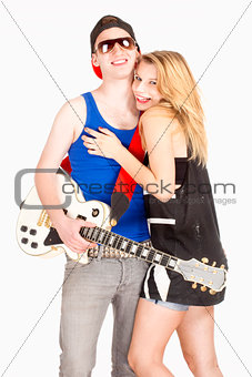 Teenage Couple - Girl Embracing her Boyfriend with Guitar 