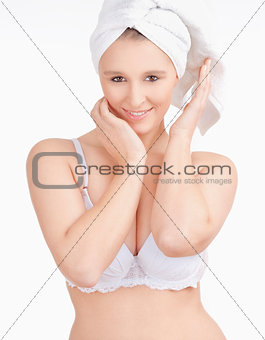 Beautiful Young Woman with Towel on her Head Smiling 