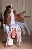 Capoeira Holding Student Backward