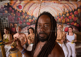 Handsome Capoeira Master with Instruments