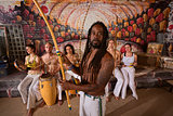 Capoeira Man with Dreadlocks and Instruments