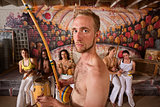 Capoeira Performer Playing Music