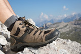 Hiking boots of a hiker in the mountains