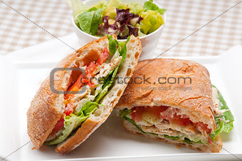 ciabatta panini sandwich with chicken and tomato