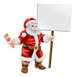 Santa holding paintbrush and sign