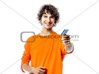 young man happy holding credit card portrait