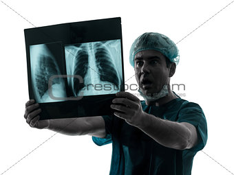 doctor surgeon radiologist surprised  examining lung torso  x-ra